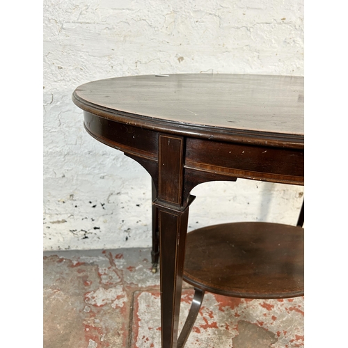 203 - An Edwardian inlaid mahogany oval two tier side table