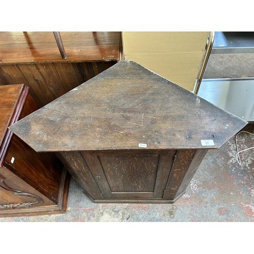 205 - A Georgian oak corner cabinet