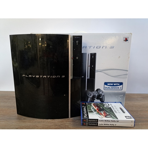 578 - A Sony PlayStation 3 console with box together with two PlayStation 2 games, Colin McRae Rally 3 and... 