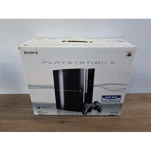 578 - A Sony PlayStation 3 console with box together with two PlayStation 2 games, Colin McRae Rally 3 and... 