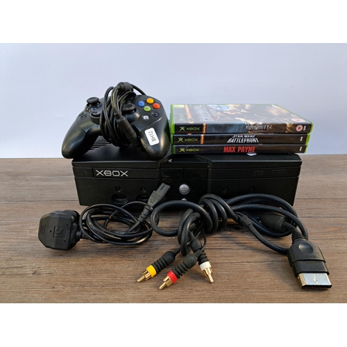 579 - A Microsoft Xbox console with controller, cables and games to include Call of Duty 2 Big Red One, St... 