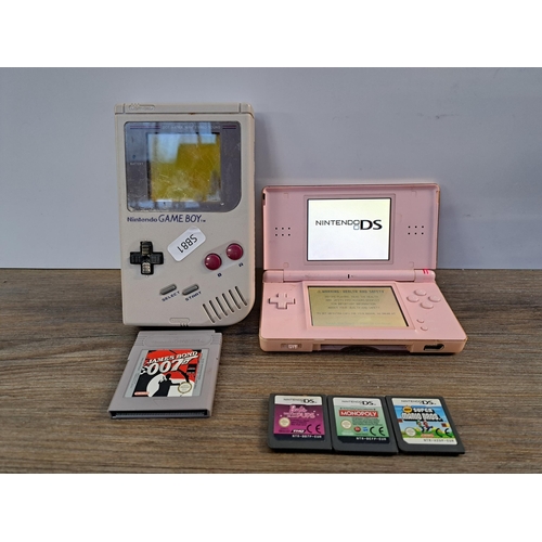 584 - A collection of Nintendo items to include Gameboy console, DS console, James Bond 007 Gameboy game, ... 