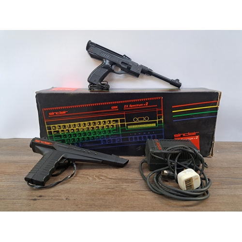 591 - A boxed Sinclair ZX Spectrum+2 Action Pack with Spectrum+2 unit, power supply, Sinclair light gun an... 