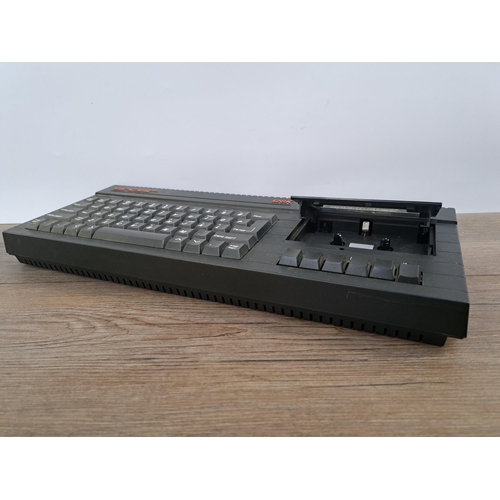 591 - A boxed Sinclair ZX Spectrum+2 Action Pack with Spectrum+2 unit, power supply, Sinclair light gun an... 