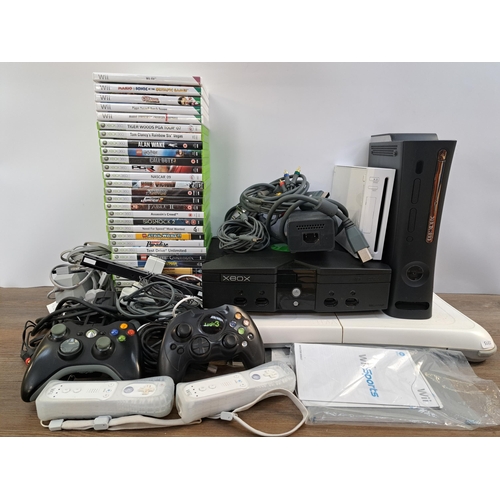 592 - A large collection of video game consoles, games and accessories to include Nintendo Wii console wit... 