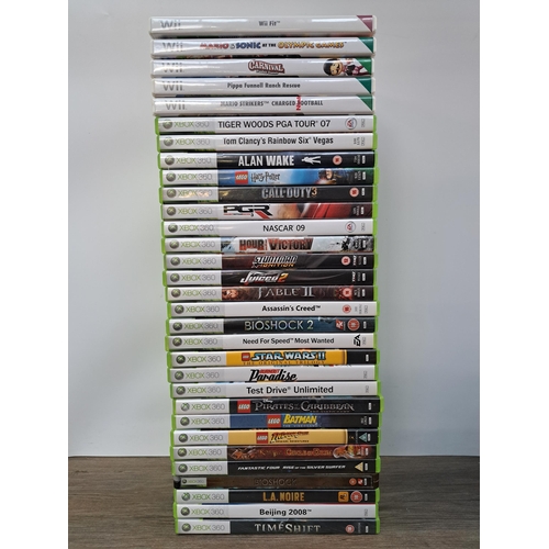 592 - A large collection of video game consoles, games and accessories to include Nintendo Wii console wit... 