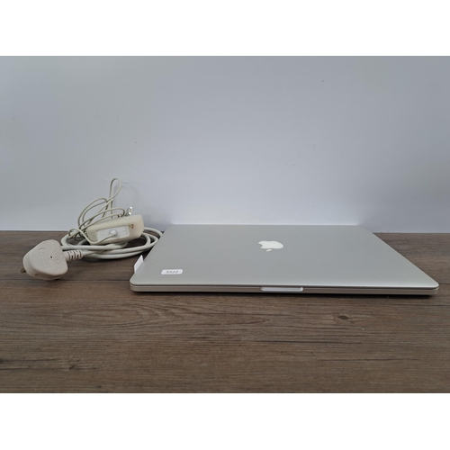 595 - An Apple A1398 MacBook Pro with charger