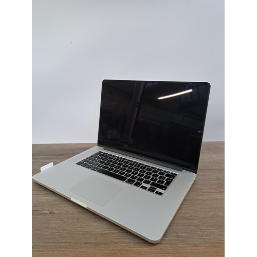 595 - An Apple A1398 MacBook Pro with charger