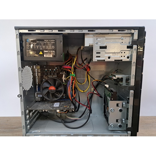 596 - An Advent DT2410 desktop computer with Samsung S20B300N 20