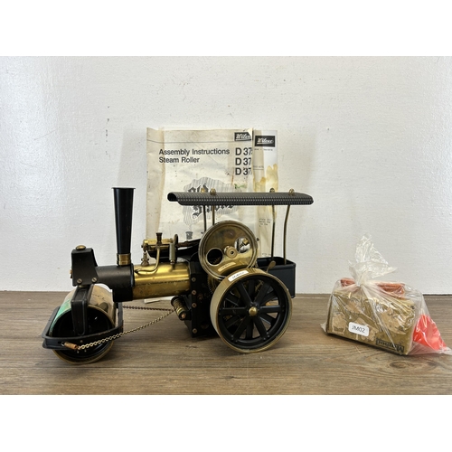 408 - A Wilesco Old Smoky live steam roller with assembly instructions and further accessories - approx. 2... 