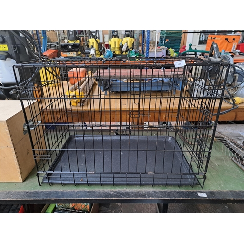 799 - A metal dog cage - approx. 55cm high x 48cm wide x 76cm deep