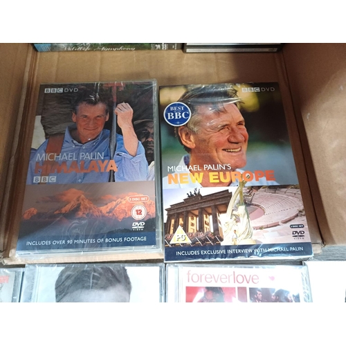 615 - A collection of sealed media to include 24 season two and three DVDs, Michael Palin 'Himalaya' and '... 