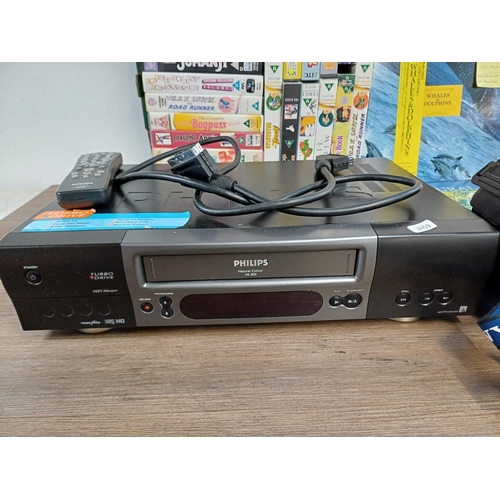 628 - A collection of items, Philips VR800 VHS VCR with remote control, cased Sony Hi8 camcorder, Olympus ... 