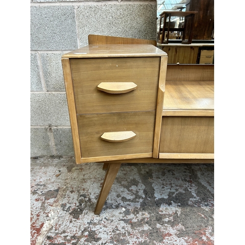 12 - A mid 20th century Avalon Yatton walnut dressing table - approx. 148cm high x 114cm wide x 45cm deep