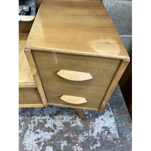 12 - A mid 20th century Avalon Yatton walnut dressing table - approx. 148cm high x 114cm wide x 45cm deep