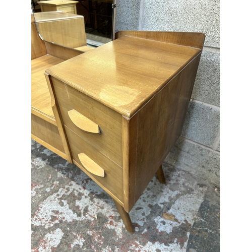 12 - A mid 20th century Avalon Yatton walnut dressing table - approx. 148cm high x 114cm wide x 45cm deep