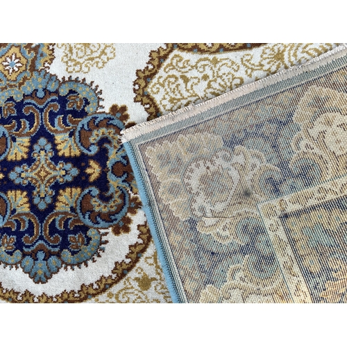 123 - A Carmel Carpets Royal 100% wool rug - approx. 250cm x 350cm