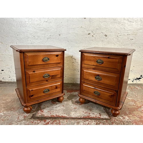 129 - A pair of modern pine bedside chests of drawers - approx. 63cm high x 47cm wide x 41cm deep