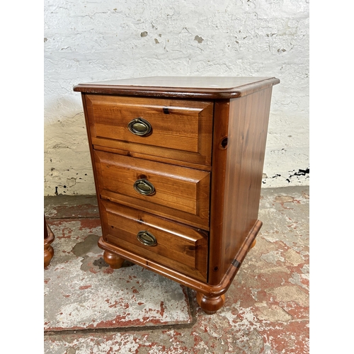 129 - A pair of modern pine bedside chests of drawers - approx. 63cm high x 47cm wide x 41cm deep