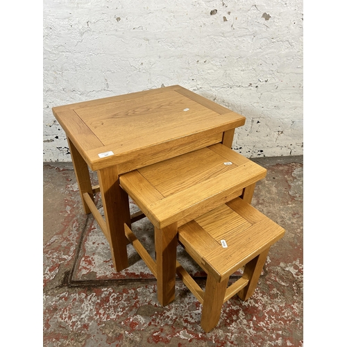 143 - A modern oak nest of tables - approx. 53cm high x 56cm wide x 43cm deep