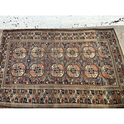 148 - A Persian hand knotted rug - approx. 185cm x 128cm