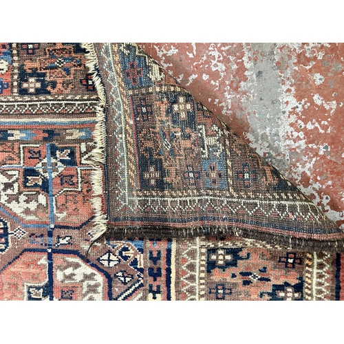 148 - A Persian hand knotted rug - approx. 185cm x 128cm