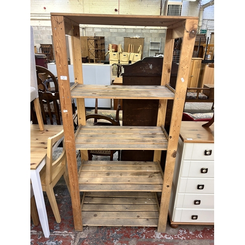 155 - A pine four tier shelving unit - approx. 168cm high x 80cm wide x 43cm deep