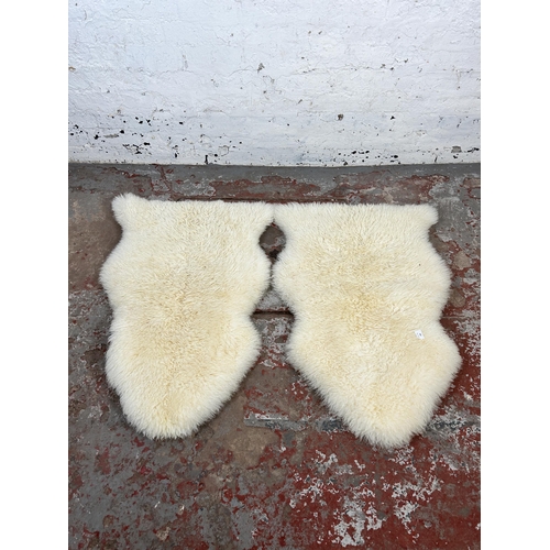 158 - Two Dunelm 100% sheepskin rugs - approx. 90cm x 60cm