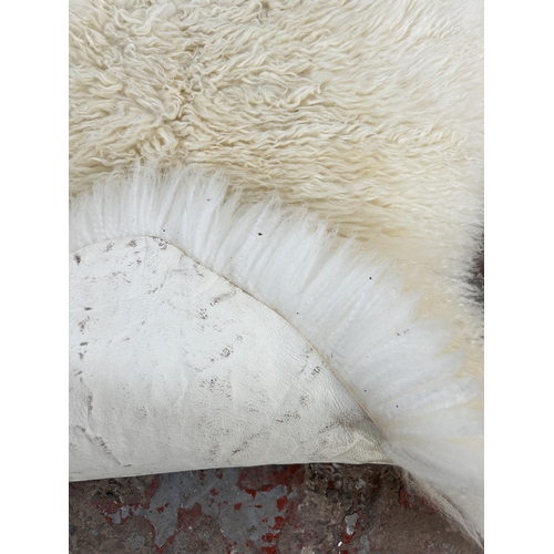 158 - Two Dunelm 100% sheepskin rugs - approx. 90cm x 60cm