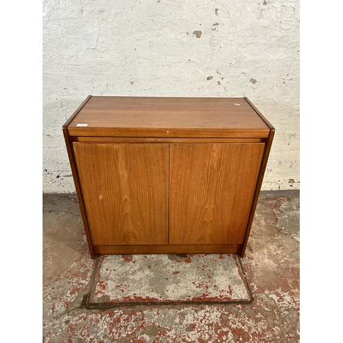 169 - A mid 20th century teak two door cabinet - approx. 73cm high x 79cm wide x 40cm deep