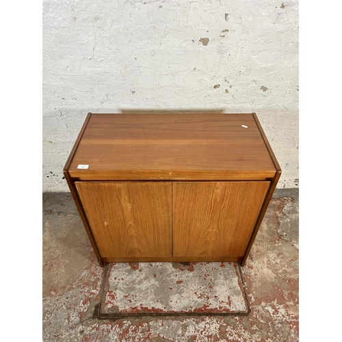 169 - A mid 20th century teak two door cabinet - approx. 73cm high x 79cm wide x 40cm deep