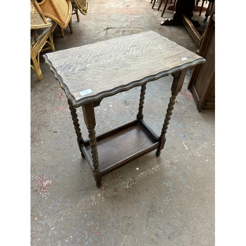 178 - An early/mid 20th century oak piecrust edge two tier side table on barley twist supports - approx. 7... 