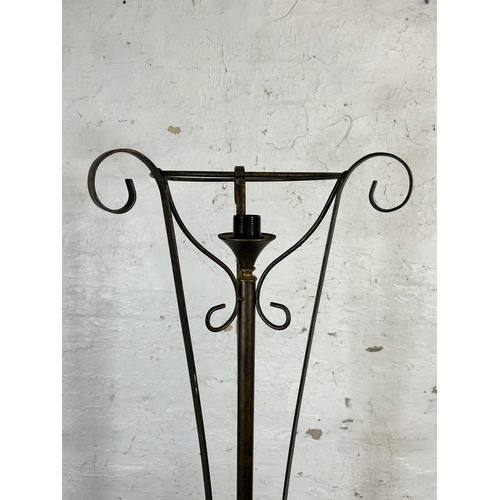 188 - A modern wrought metal standard lamp - approx. 170cm high