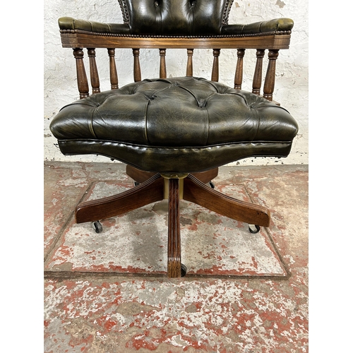 190 - A beech and green leather Chesterfield captain's swivel office desk chair