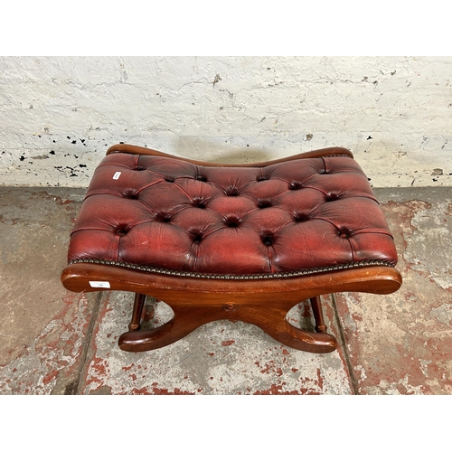 196 - A mahogany and oxblood leather chesterfield footstool