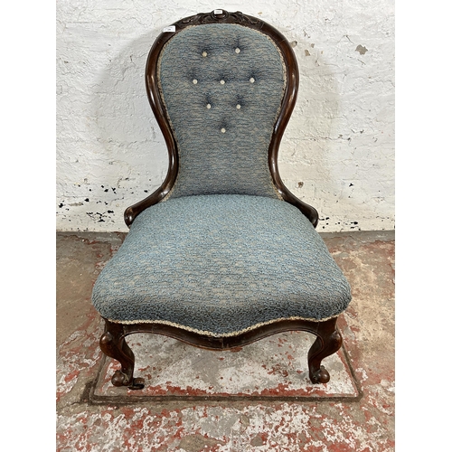 199 - A Victorian carved mahogany and blue fabric upholstered spoon back nursing chair