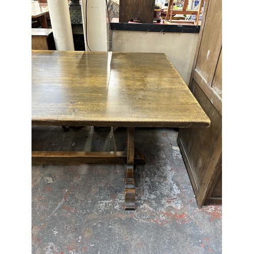 206 - A solid oak refectory dining table - approx. 76cm high x 90cm wide x 183cm long