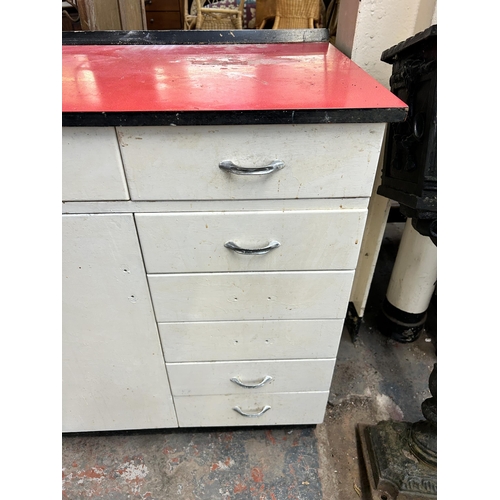 208 - A 1950s white painted and red laminate kitchen cabinet - approx. 91cm high x 79cm wide x 53cm deep