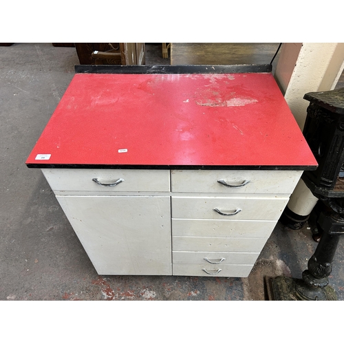 208 - A 1950s white painted and red laminate kitchen cabinet - approx. 91cm high x 79cm wide x 53cm deep