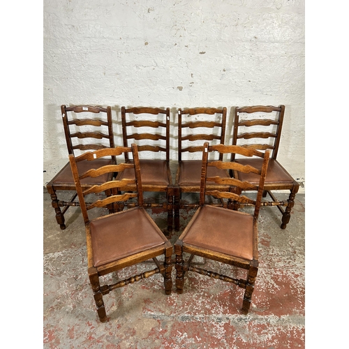 212 - Six oak ladder back dining chairs