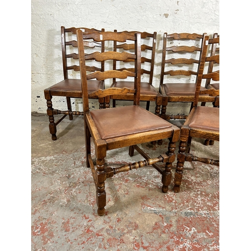 212 - Six oak ladder back dining chairs