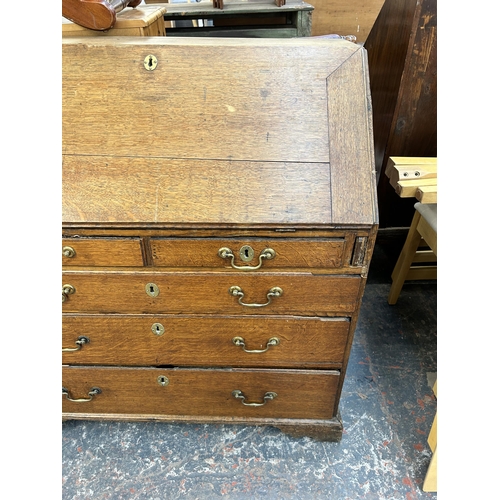 214 - A George III oak bureau