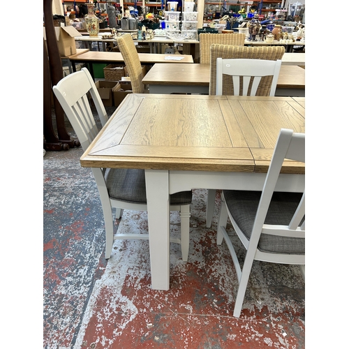 217 - A modern oak and grey painted extending dining table and four chairs - approx. 80cm high x 90cm wide... 