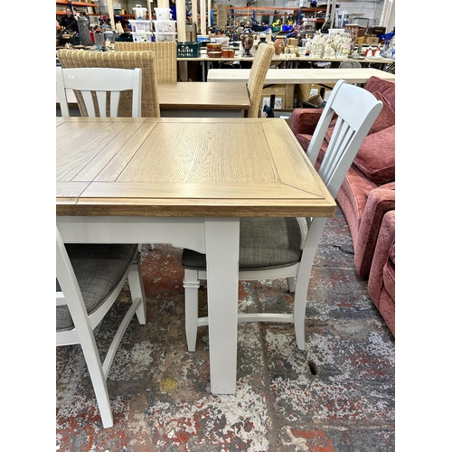 217 - A modern oak and grey painted extending dining table and four chairs - approx. 80cm high x 90cm wide... 