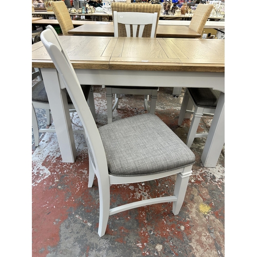 217 - A modern oak and grey painted extending dining table and four chairs - approx. 80cm high x 90cm wide... 