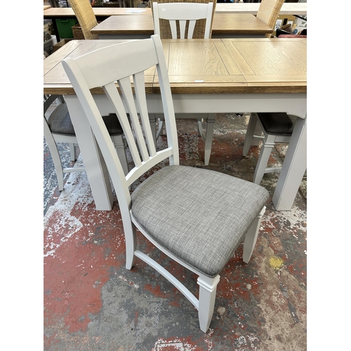 217 - A modern oak and grey painted extending dining table and four chairs - approx. 80cm high x 90cm wide... 