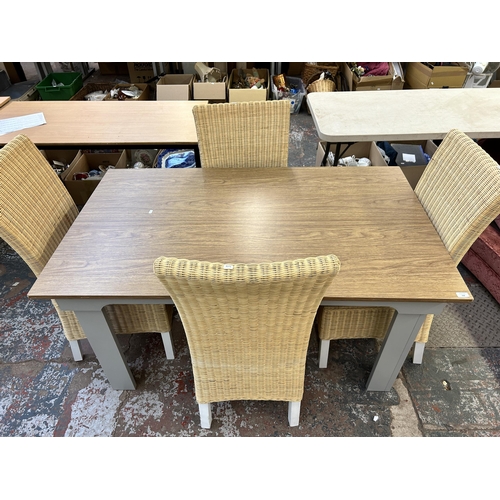 218 - A modern oak effect and grey painted dining table and four wicker chairs - approx. 75cm high x 90cm ... 