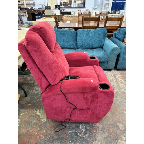 221 - A modern pink fabric upholstered electric reclining armchair with remote control and power supply