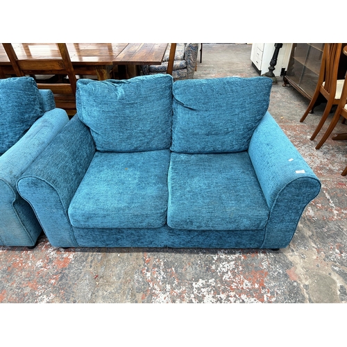 223 - A modern teal fabric upholstered two piece lounge suite comprising three seater sofa and two seater ... 