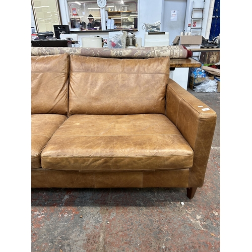 225 - A John Lewis tan leather three seater sofa - approx. 88cm high x 187cm wide x 97cm deep